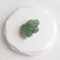 Hand-carved light green natural stone crocodile figurine with a smooth polished finish - Green Aventurine