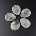 Polished grey natural stone thumb massagers with black speckled texture in drop shape - Labradorite
