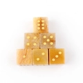 Set of 6 yellow stone dice with golden dots and natural marble texture for games - Topaz