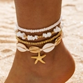 Bohemian multi-layer beach anklet set with shells, starfish, and beads on sand - Shell Starfish Multi Layer Stackable Style (7072-4-R-G)