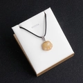 Pale yellow natural agate stone necklace with carved pet paw pendant on black cord - Topaz
