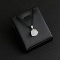Minimalist white stone cat paw pendant necklace with a black braided cord strap - White Crystal