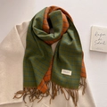 Detail of vintage green and orange plaid scarf with fringe and woven brand label - Olive Green