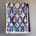 Detailed view of bohemian ikat pattern scarf with thick woven texture and fringed edges - Dark Blue