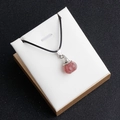Pink strawberry crystal pumpkin wizard hat pendant with black cord in a jewelry box - Strawberry Quartz