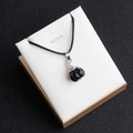 Polished black gemstone pumpkin pendant necklace with silver clasp and black cord - Obsidian