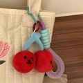 Cute cherry plush keychain with smiling faces on light quilted bag, macaron color accessory - Red Cherry Emoji Pendant With Purple Handle