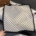 Detail of square polka dot silk scarf with black border on a white plush background - FW-166-White
