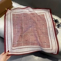 Detailed view of red and white paisley cotton-linen scarf on a plush background - FW-194-Red