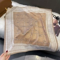 Macro detail of silk-texture paisley square scarf on white faux fur background - FW-194-Camel