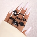 Set di 7 anelli gotici nero opaco con teschi e motivi a raggiera per donna - Set da 7 Pezzi Minimalista ECG Girasole (23671-black)