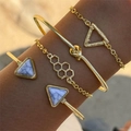 Close-up of four-piece gold bracelet set with geometric marble stone and honeycomb charms - Honeycomb Knot Style Set (25533-gold)