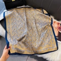 Flat lay of vintage golden paisley silk square scarf with navy blue border on fur background - 70x70cm / Blue Edge (W-444)