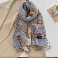 Close-up of blue and beige plaid scarf with fringe detail and elegant woven label - Light Blue (FYR-282-Light Blue)