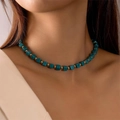 Detailed close-up of Bohemian turquoise square beads and golden spacers on a beach necklace - Gold Turquoise Square Bead Choker (25483-blue)
