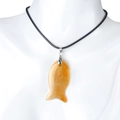 Minimalist fish-shaped semi-precious stone pendant in translucent orange with black cord - Yellow Jade (With Cord)