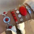 Bohemian silver bangle set featuring red turquoise stones and intricate feather charms - Silver Red