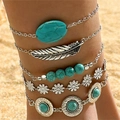 Bohemian silver anklet set featuring turquoise stones and feather charm on a beach - Anklet Style Blue