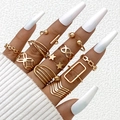 10-piece gold geometric ring set featuring cutout stars and minimalist chain link textures - Geometric Star Gold Style (25379-gold)
