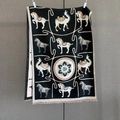 Detail of floral and animal jacquard patterns on black cashmere feel scarf with fringe - Black