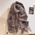 Detailed macro view of a blue and brown plaid scarf with tassels on a wool coat - Blue Brown (FYR-292-Blue Brown)