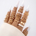 15-piece bohemian gold ring set with pearls and leaf designs on a model hand - Gold Leaf Wrap Style (25260-ring-G)