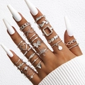 Dettaglio set 20 anelli boho argento con motivi a farfalla cuore e stella - Stile argento 25432