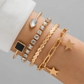 Four-piece gold bracelet set featuring black square elements and star charms - Star Pendant Four Piece Gold Bracelet Set (24447-A)