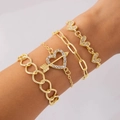 Four-piece gold bracelet set featuring heart charms and paperclip chain style - Rhinestone Heart And Arrow Four Piece Gold Bracelet Set (25715-gold)