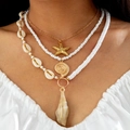 Multilayer beaded necklace set featuring golden starfish, shell charms and faux pearls - Four-Layer White Gold Conch Layered (29928-G white)