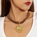 Detail of sunflower pendant on a brown braided cord showing high-quality metallic texture - Sunflower(30243-nek-brown)