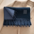Dark blue wool blend scarf with tassels and leather tag on camel coat background - 33x185cm / Dark Blue