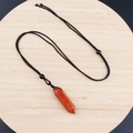 Hexagonal red jasper stone pendant necklace featuring a black braided cord strap - Red Jasper With Cord