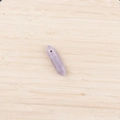 Minimalist double-pointed hexagonal lavender amethyst pendant on a natural wood surface - Lepidolite With Cord