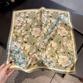 Detail of silk square scarf featuring floral patterns and smooth satin texture finish - 53x53cm / Matcha Green