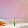 Bohemian gold chain necklace featuring a vibrant green chili pendant on a sandy surface - Gold Chain Green Chili Pendant Style (27255-3-green)