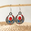 Detail of vintage bohemian earrings with red resin gems hanging on a branch - Red Blue Black Painted Round Hollow Ethnic Earrings (27037-colour)