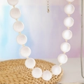 Detailed view of large translucent white beads on a bohemian ethnic style necklace - Bohemian Beaded Style (27326) / 18mm Bead Diameter / White