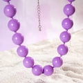 Detailed macro view of large purple resin beads with silver lobster clasp and chain - Bohemian Beaded Style (27326) / 18mm Bead Diameter / Purple