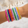 Close-up of bohemian seed bead bracelet set worn on wrist with 13 colorful rainbow layers - 13-Piece Rainbow Color System Set (28414-colour)