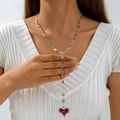 Detail of bohemian Y-shaped beaded necklace with red heart pendant and cross motif - Multicolored Bead Chain Red Heart Cross (30741-nek-S-1)