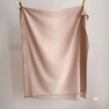 Detailed view of the fine fringe edge and silky texture on this pink gradient pashmina shawl - 80*200cm / Nude Pink Gradient