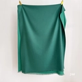 Close-up of dark green solid scarf showing soft texture and fine fringe edge detail - Dark Green (SM-24)