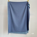Detail of blue cashmere feel scarf with fine tassel edges and soft knitted texture - Navy Blue (SM-15)