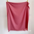 Detail shot of rose red cashmere feel scarf featuring delicate short fringe and soft texture - Deep Pink (SM-22)