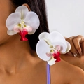 Macro side view of a model wearing large white orchid floral earrings with pink details - White with Red Heart (27335-8-red white)