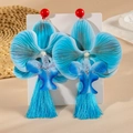 Detailed close-up of oversized blue orchid tassel earrings with bohemian fabric floral design - Blue Orchid with Blue Tassel (29404-2-blue)
