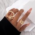 Close-up of gold minimalist geometric hollow rings set on finger with polished finish - Gold Large Intertwined Rings (28221-G)