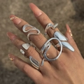Detail of silver irregular hollow stackable rings set with a polished metallic finish - Silver Liquid Irregular Set (28255-S)