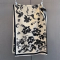 Close-up of winter scarf with black floral print, fringed edges and soft white base - 185*65cm / Black